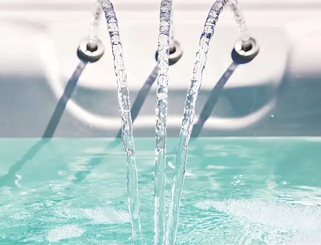 Three chutes in a jacuzzi spraying water