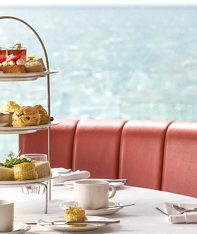An afternoon tea stand with snacks on a table