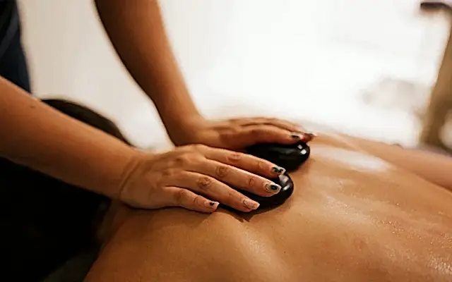 A massage aided by black stones