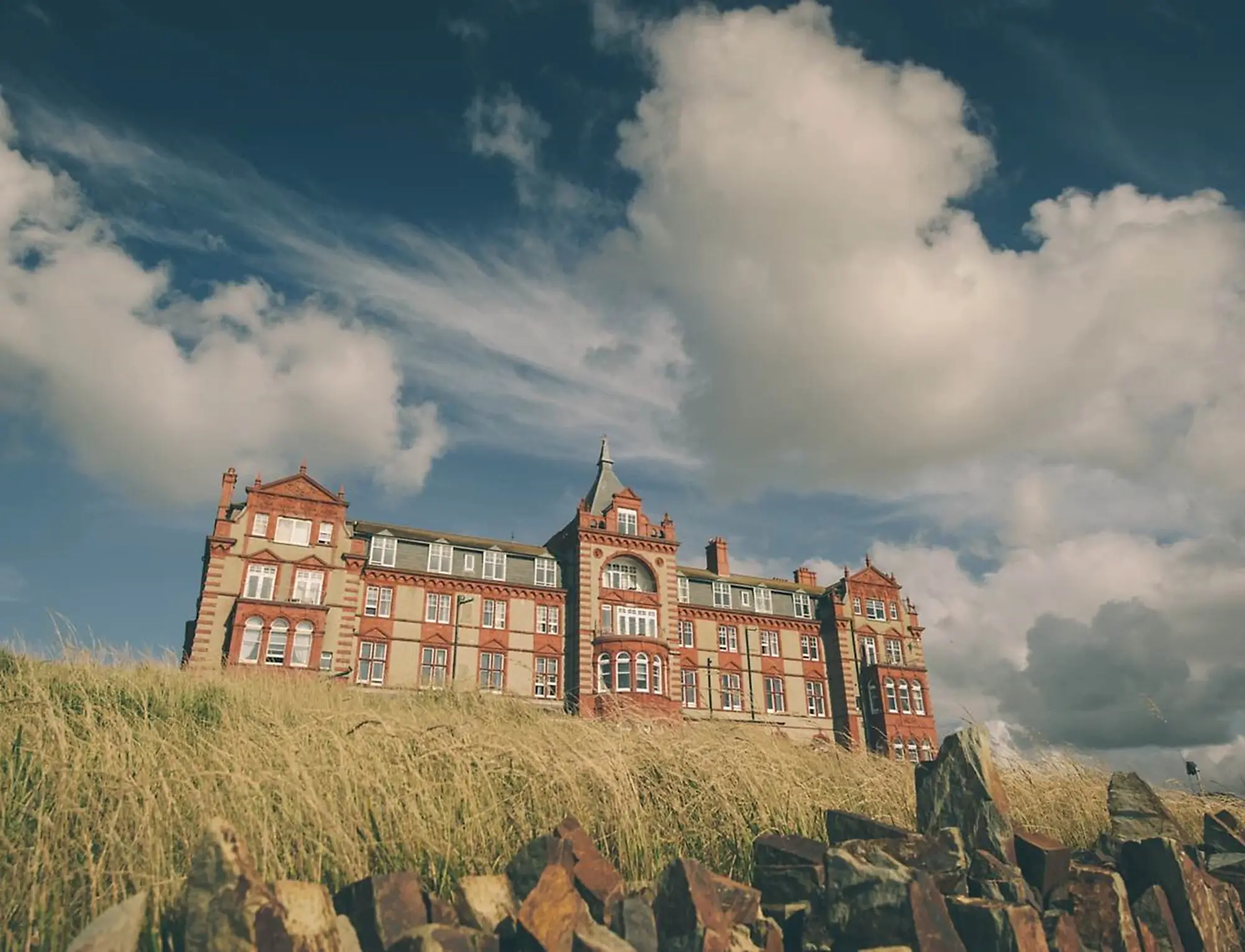  a view of the headland hotel from the grass outside