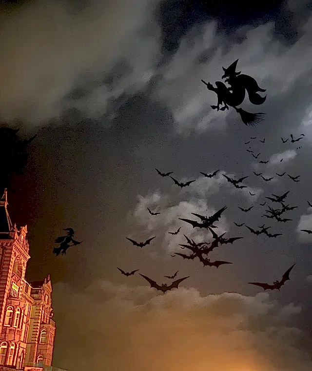 witches on a dark night flying on broomsticks around the headland hotel