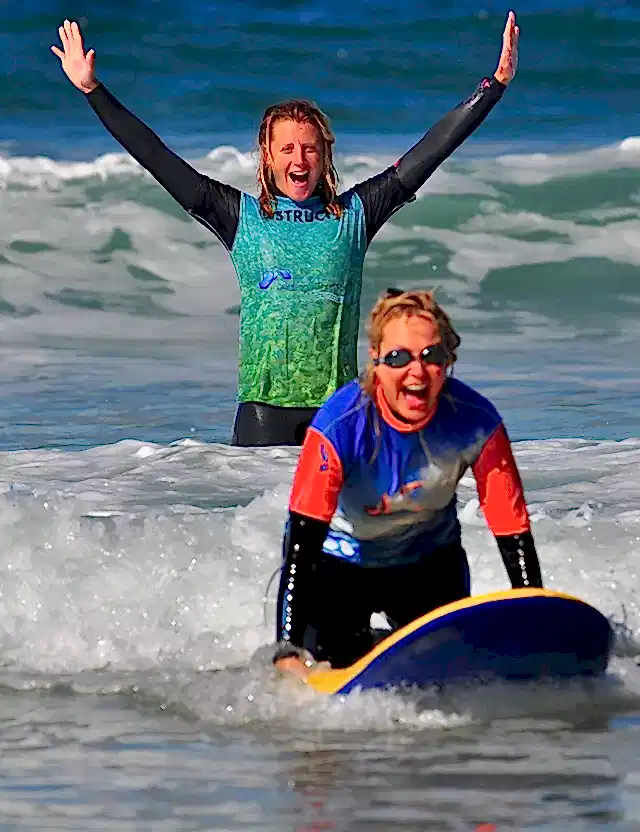 Two people surfing in the sea