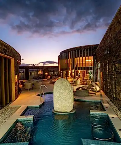 An image of the stone in the back of the Headland pool at night