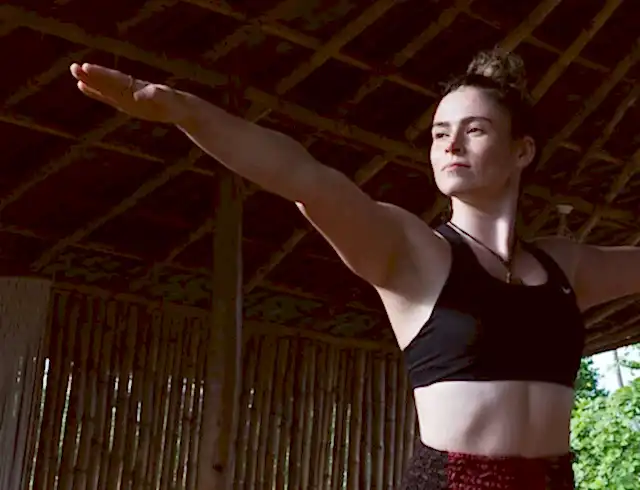 A woman holding a yoga pose