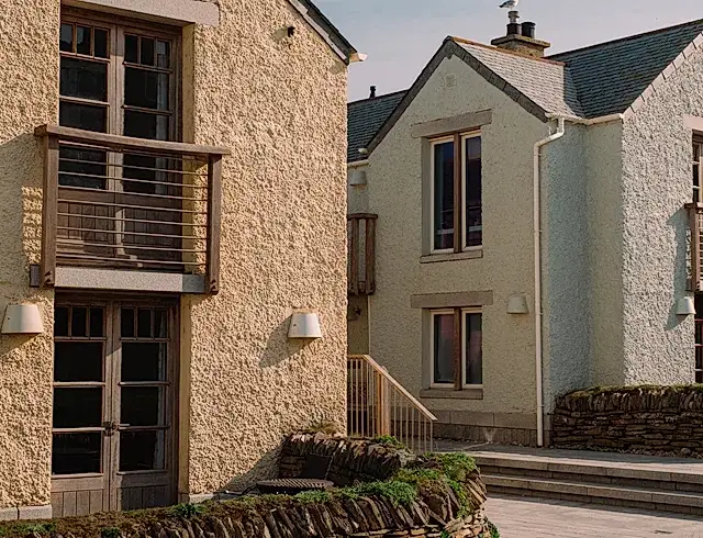 a view of two cottages in the Headland hotel