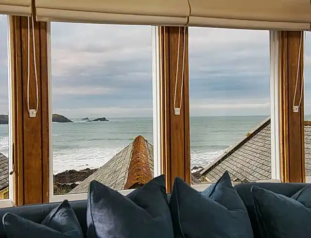 a view of the beach from a conservatory window