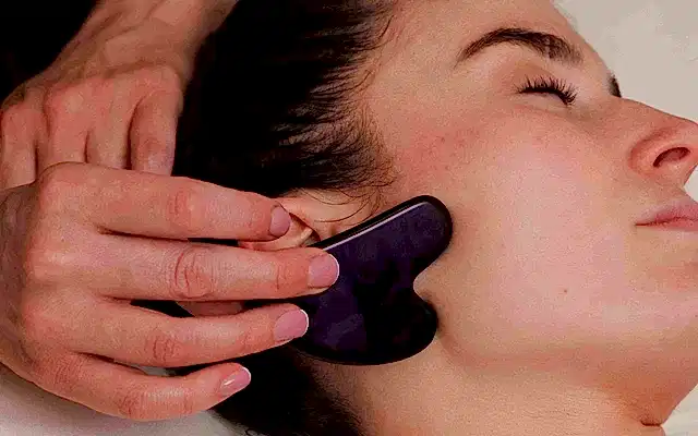 a woman receiving a massage and treatment